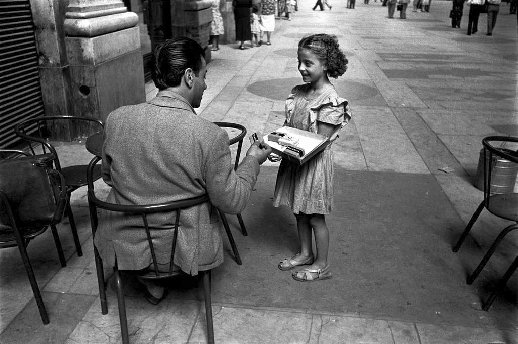 Girl selling black-market cigarettes in Naples, 1948 David Seymour, Public domain