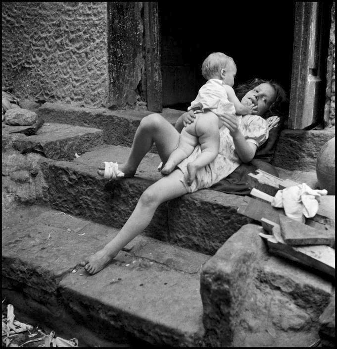 Girl playing with her baby brother, Naples 1948 by David Seymour Public domain